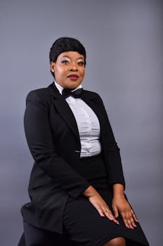 Sophisticated portrait of an African businesswoman in elegant attire. Perfect for corporate themes.